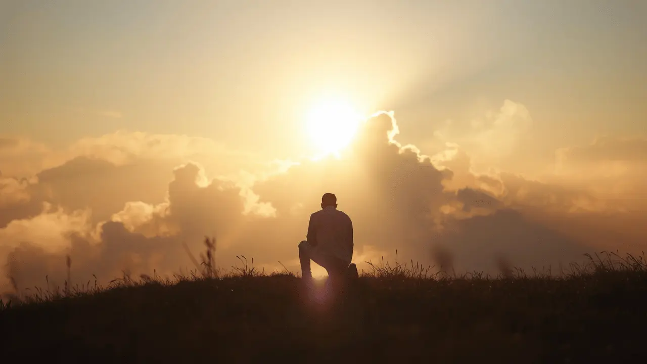 a person kneeling at sunrise on a hill, surrounded by golden light breaking through clouds, symbolizing mercy, repentance, and new beginnings.