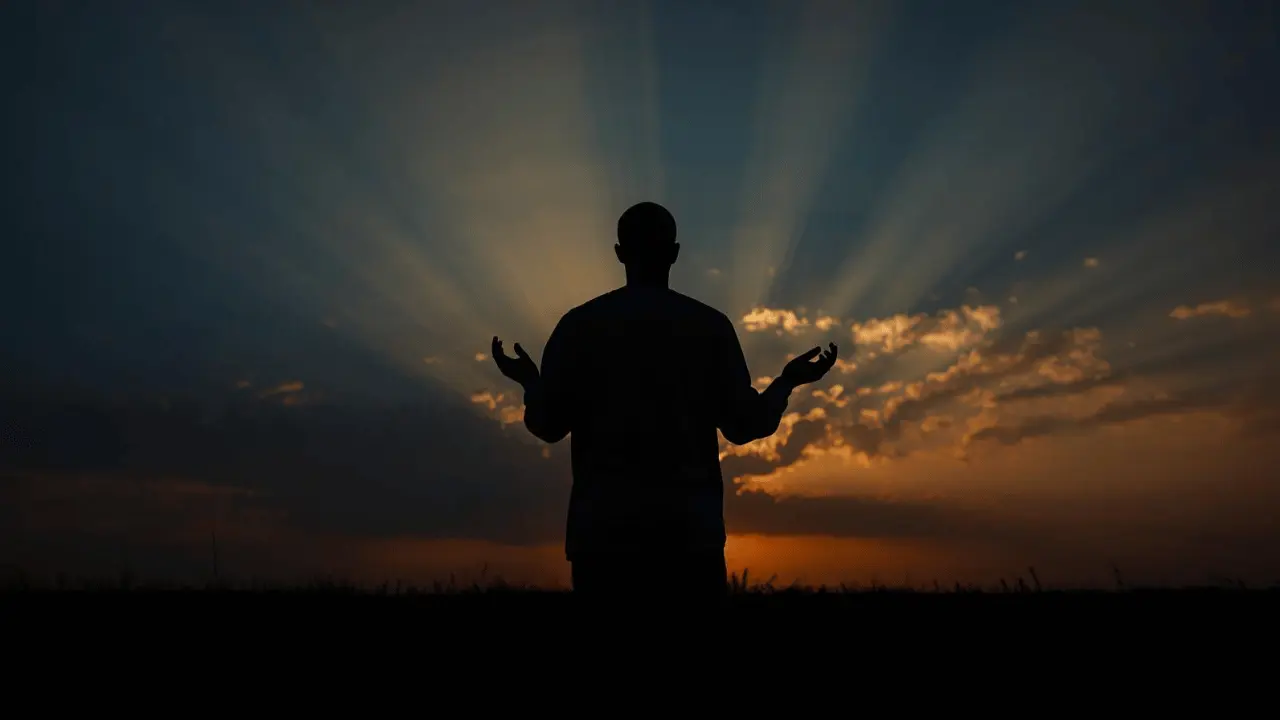 Silhouette of King David kneeling under a golden sunrise, symbolizing hope emerging after a night of despair