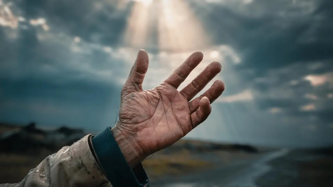 A person walking on a long road toward light, symbolizing ongoing spiritual growth and transformation